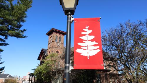 College hall and red pine banner