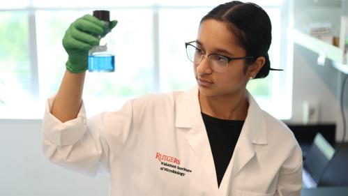 A student holds a beaker