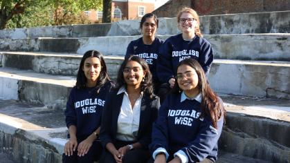 Students in Dougalss WiSE Sweatshirts on Antilles Field 