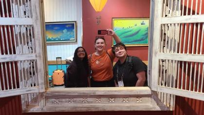 Three Students at Conference