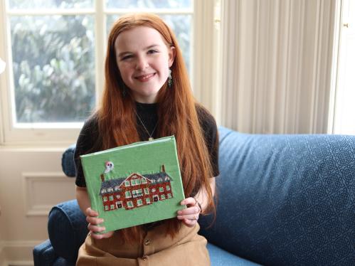 Douglass student holding art book