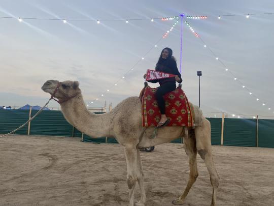 Douglass Global Leader on a camel