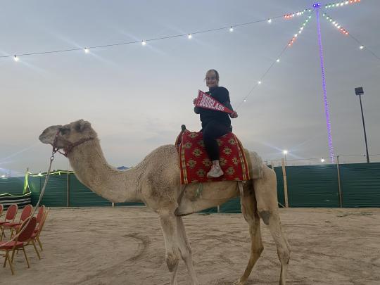 Douglass Global Leader on a camel