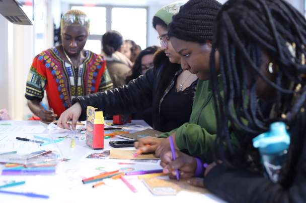 Students Decorate Journals at Women's Day