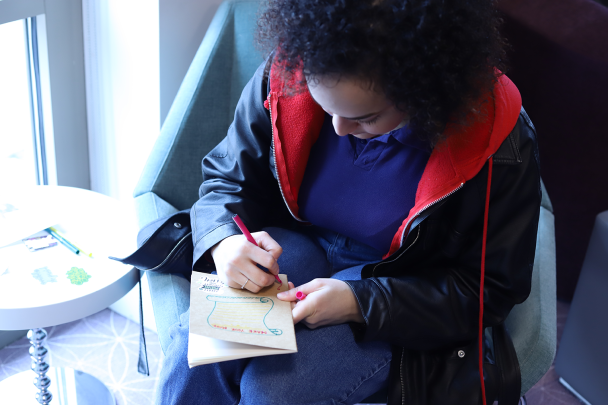 Students Decorate Journals at Women's Day