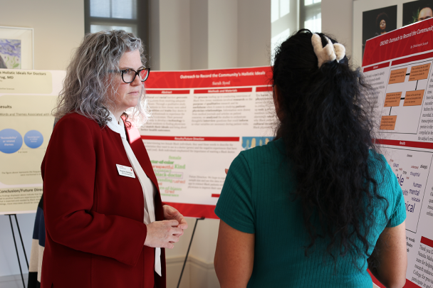 Student presents project to Dean Rehbein 