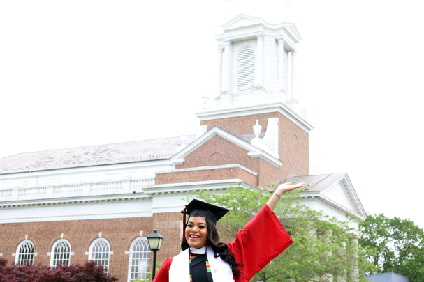 student in front of Voorhees Chapel