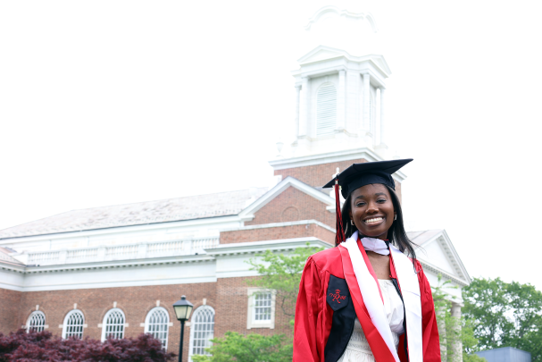 grad in front of Voorhees Chapel