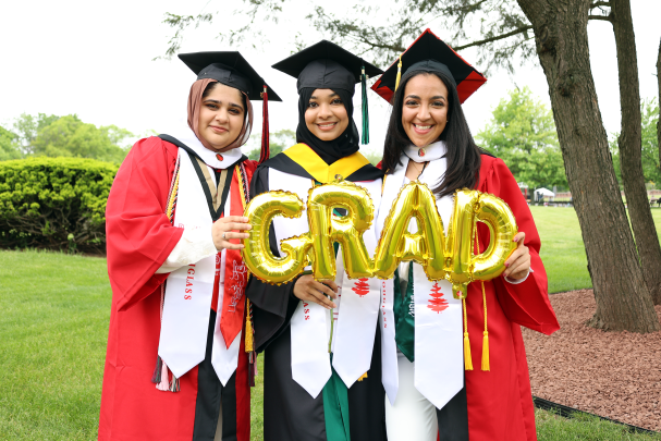 Douglass grads holding balloons