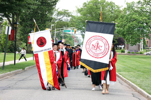 platform party walks down Chapel Drive