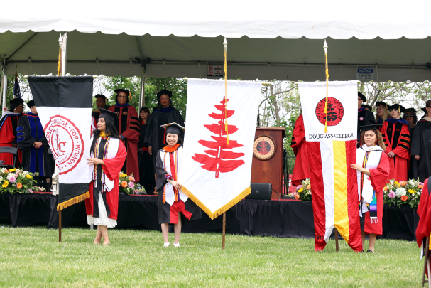 Douglass grads and flags on field 