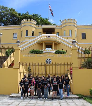 Group stands in front of Museo Nacional De Costa Rica