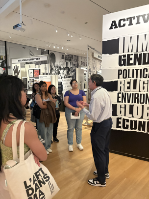 Students listen to guide in museum