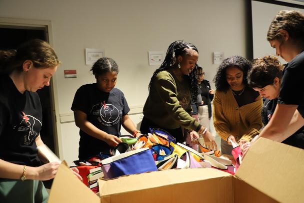 Students pack goods for collections drive
