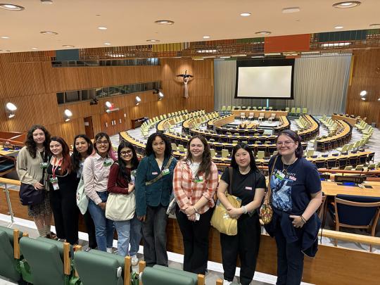 Students in large assembly room