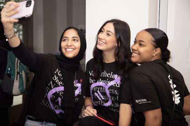 students take selfie at event